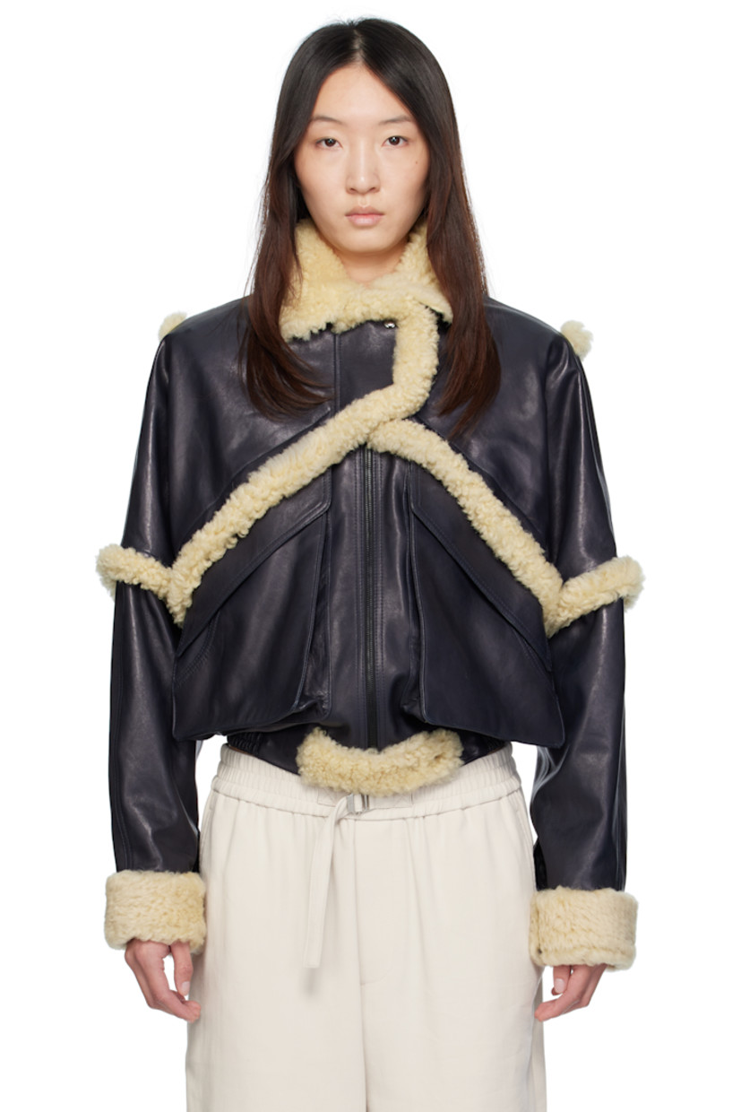 Grained sheepskin bomber jacket. Shearling trim throughout.

· Spread collar
· Press-stud tabs at zip closure
· Flap pockets
· Elasticized hem
· Press-stud barrel cuffs
· Full viscose twill lining

Supplier color: Navy