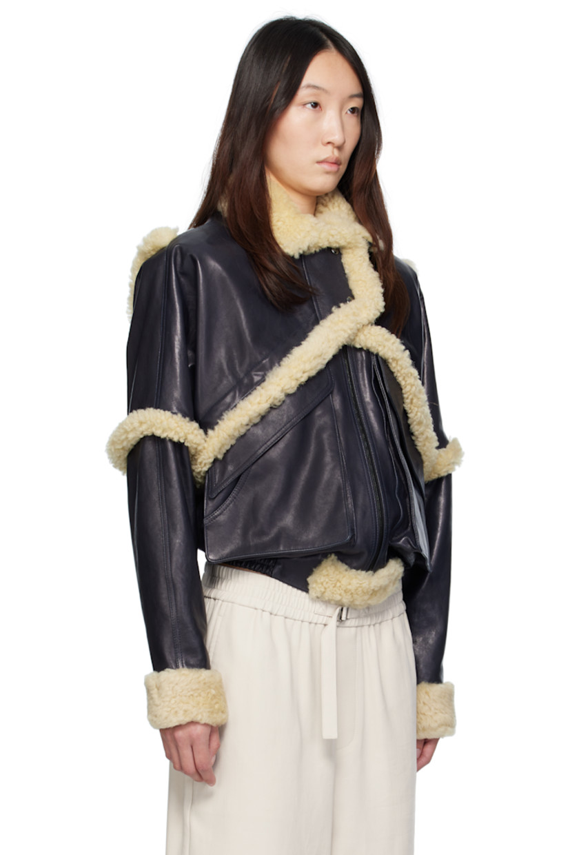 Grained sheepskin bomber jacket. Shearling trim throughout.

· Spread collar
· Press-stud tabs at zip closure
· Flap pockets
· Elasticized hem
· Press-stud barrel cuffs
· Full viscose twill lining

Supplier color: Navy