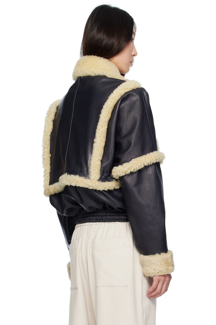 Grained sheepskin bomber jacket. Shearling trim throughout.

· Spread collar
· Press-stud tabs at zip closure
· Flap pockets
· Elasticized hem
· Press-stud barrel cuffs
· Full viscose twill lining

Supplier color: Navy