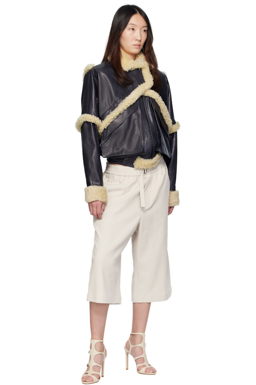 Grained sheepskin bomber jacket. Shearling trim throughout.

· Spread collar
· Press-stud tabs at zip closure
· Flap pockets
· Elasticized hem
· Press-stud barrel cuffs
· Full viscose twill lining

Supplier color: Navy