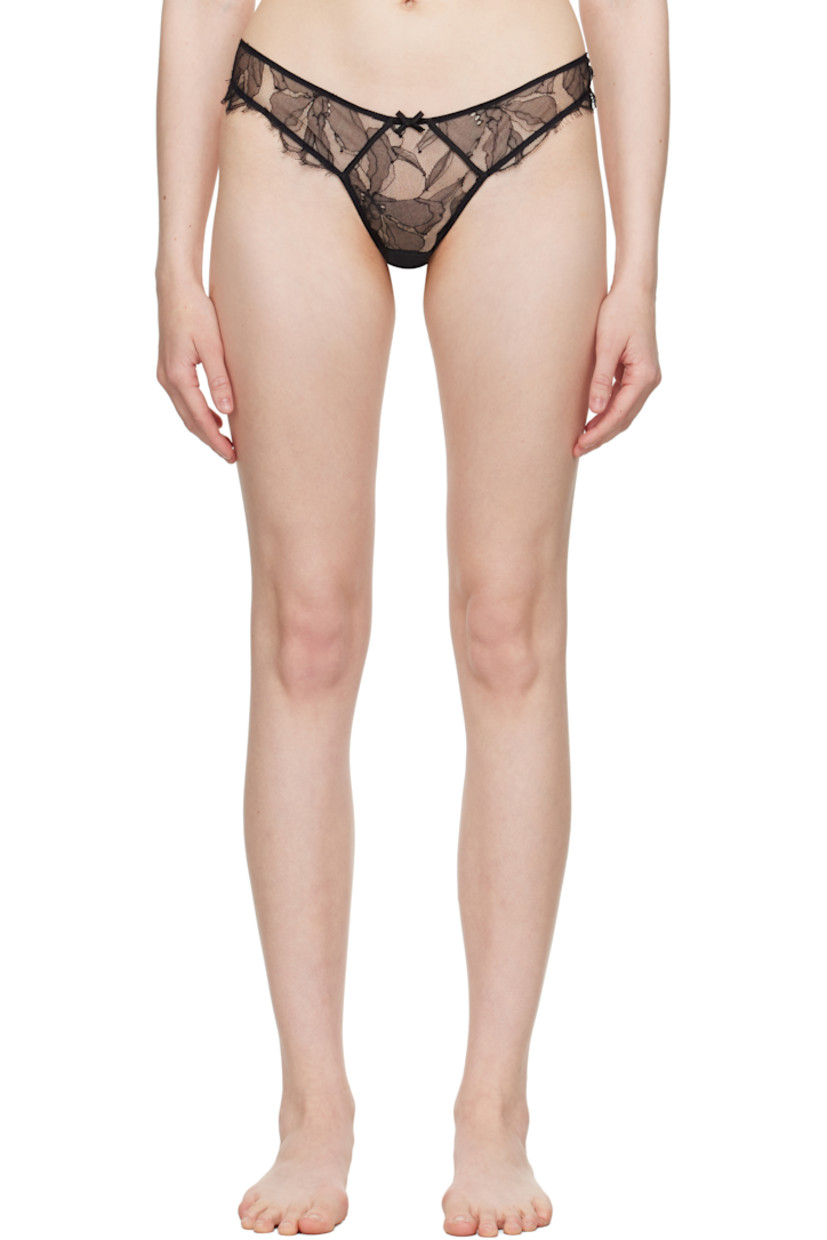 Sheer nylon-blend lace and stretch nylon mesh thong. Raw edges and embroidered detailing throughout.

· Bow accent at elasticized waistband
· Scalloped edge at front
· Stretch silk satin gusset at bottom
· Cutout at back
· Partial cotton jersey lining

Supplier color: Black