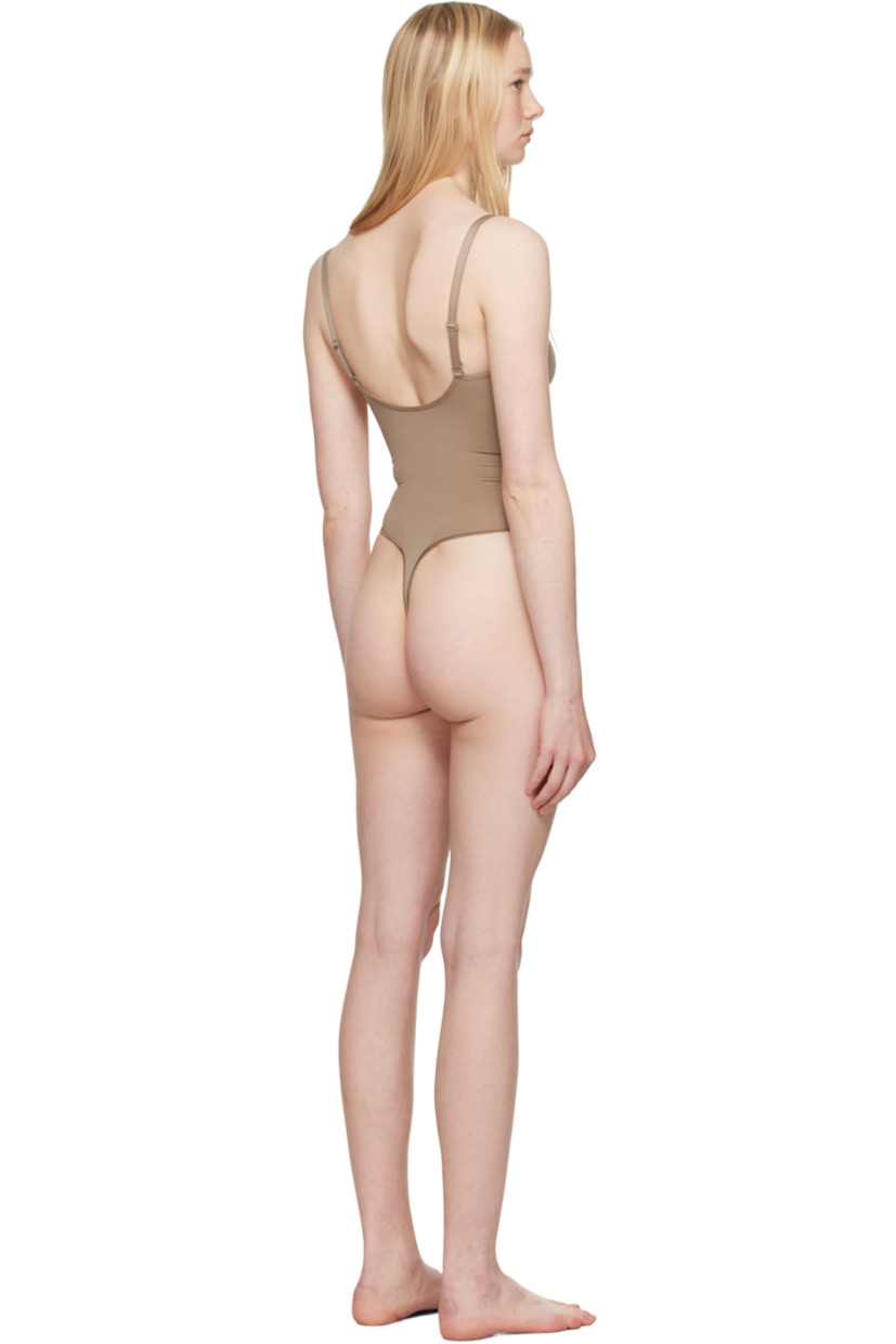 Stretch nylon jersey bodysuit.

· Sweetheart neck
· Ruching at chest
· High-compression waist
· Press-stud fastening at bottom
· Adjustable elasticized spaghetti straps
· Low back
· Partial cotton lining

Supplier color: Sienna