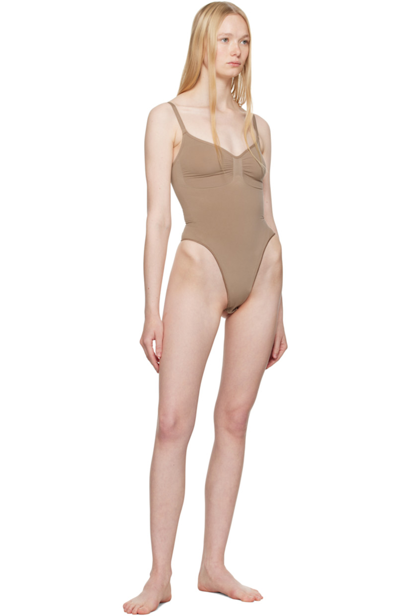 Stretch nylon jersey bodysuit.

· Sweetheart neck
· Ruching at chest
· High-compression waist
· Press-stud fastening at bottom
· Adjustable elasticized spaghetti straps
· Low back
· Partial cotton lining

Supplier color: Sienna