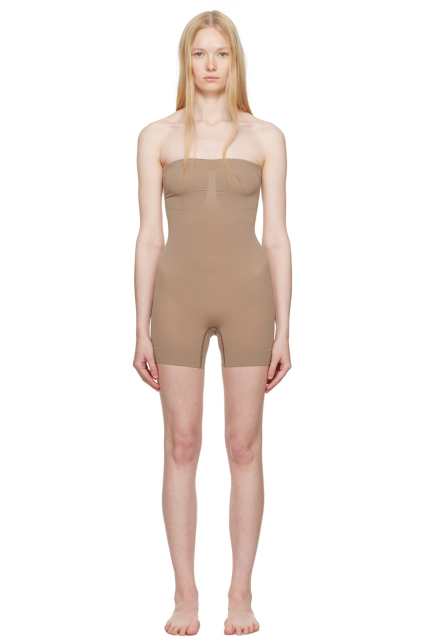Stretch recycled nylon-blend jersey bodysuit. Includes adjustable and detachable shoulder straps for alternate styling.

· Elasticized straight neck
· Ruching at chest
· High-compression waist
· Lapped gusset at bottom

Supplier color: Sienna