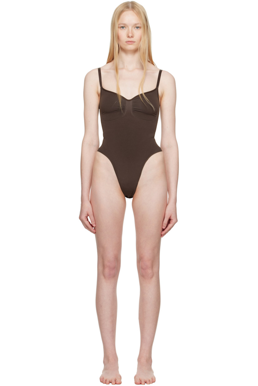 Stretch nylon jersey bodysuit.

· Sweetheart neck
· Ruching at chest
· High-compression waist
· Press-stud fastening at bottom
· Adjustable elasticized spaghetti straps
· Low back
· Partial cotton lining

Supplier color: Cocoa