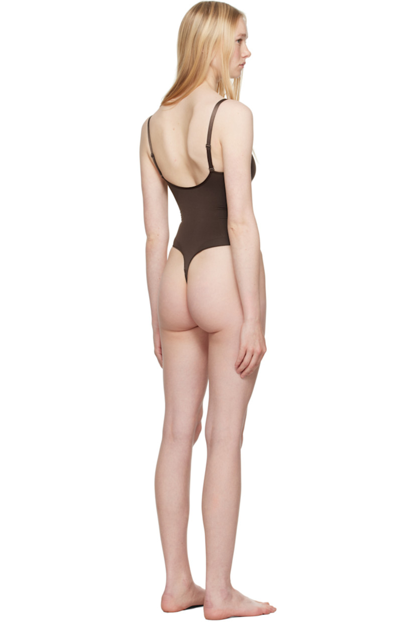 Stretch nylon jersey bodysuit.

· Sweetheart neck
· Ruching at chest
· High-compression waist
· Press-stud fastening at bottom
· Adjustable elasticized spaghetti straps
· Low back
· Partial cotton lining

Supplier color: Cocoa
