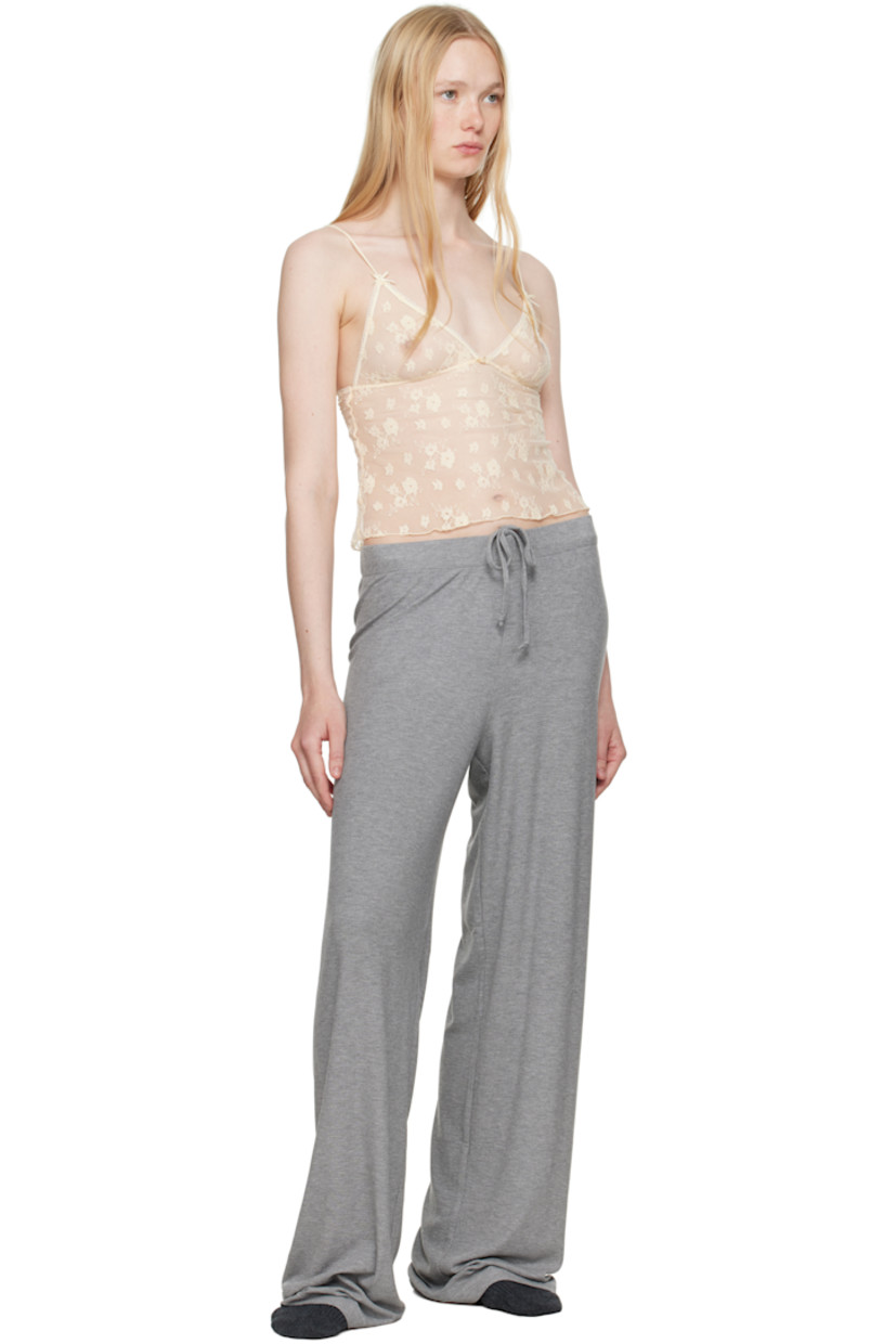 Sheer stretch nylon-blend lace camisole. Floral pattern throughout.

· Picot trim at plunging V-neck
· Floral appliqué at chest
· Bow appliqué at adjustable spaghetti straps

Wholesale exclusivity at SSENSE.

Supplier color: Butter two tone