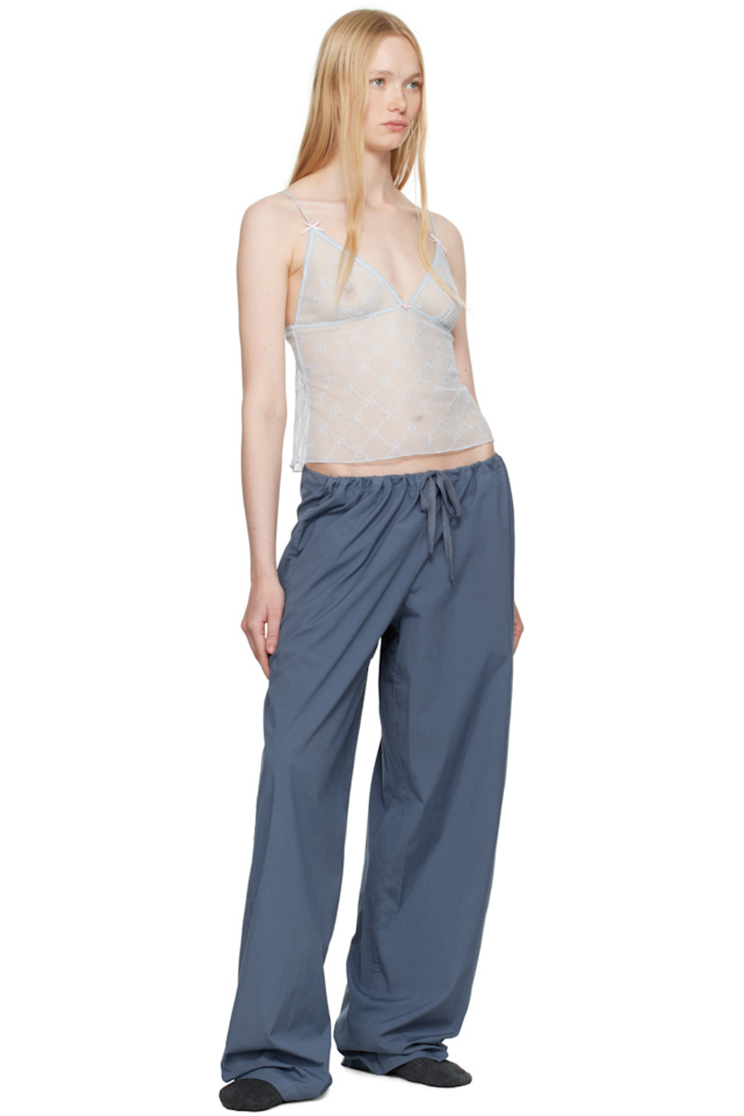 Sheer nylon tulle camisole. Embroidered graphic pattern throughout.

· Picot trim at plunging V-neck
· Floral appliqué at chest
· Bow appliqué at adjustable spaghetti straps

Wholesale exclusivity at SSENSE.

Supplier color: Powder blue bow tulle