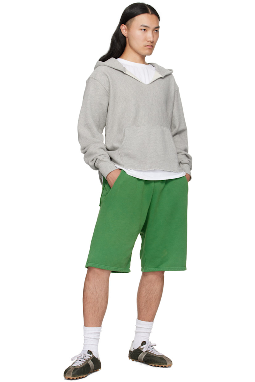 Heavyweight brushed cotton fleece shorts.

· Pre-shrunk and garment-dyed
· Fading throughout
· Concealed drawstring at elasticized waistband
· Four-pocket styling
· Hammer loop and patch pocket at outseam
· Rolled raw edges at back pockets

Supplier color: Washed basil