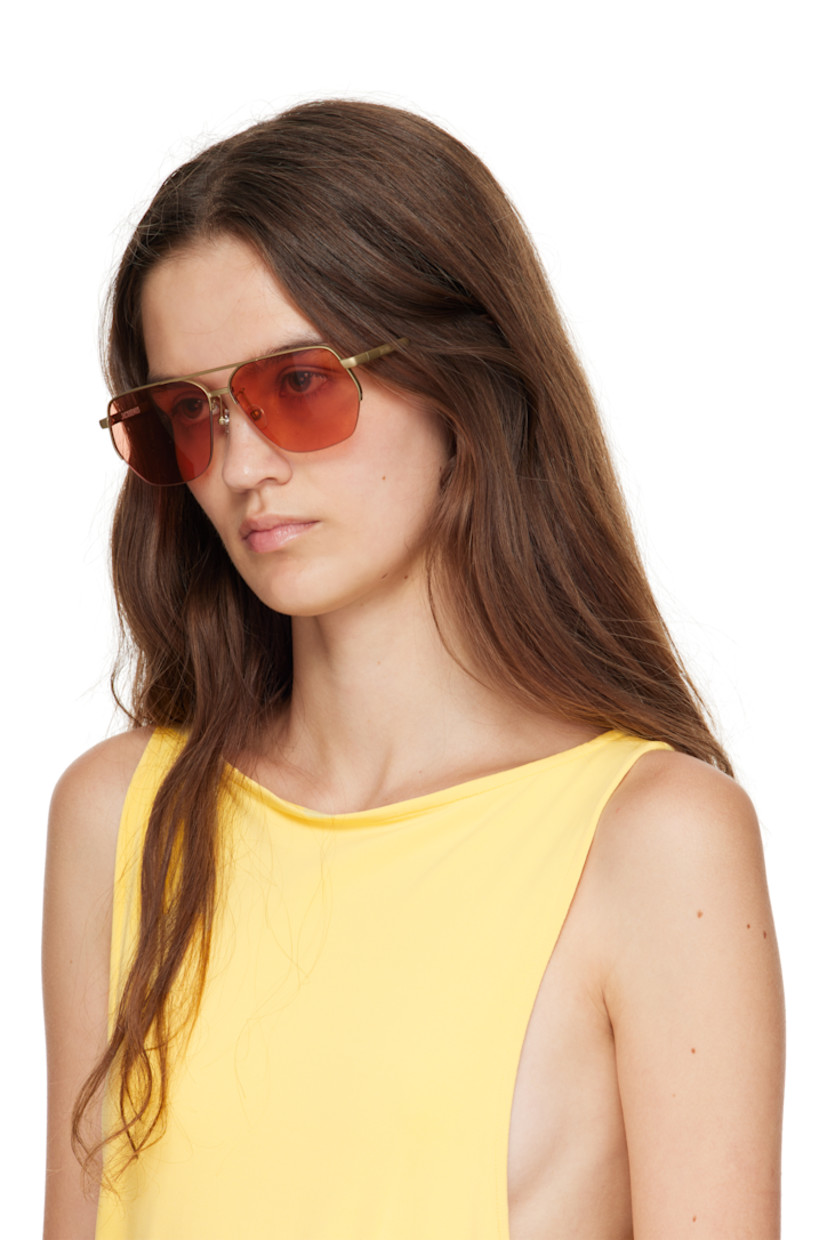 Aviator-style stainless steel frame sunglasses.

· Red lenses 
· 100% UVA/UVB protection, category 2
· Adjustable rubber nose pads
· Double bridge
· Logo engraved at temples
· Black acetate temple tips
· Eyewear chain-compatible
· Includes pouch
· Size: 63.13 145

Part of the La Croisière collection. 

Supplier color: Putty/Black/Amber