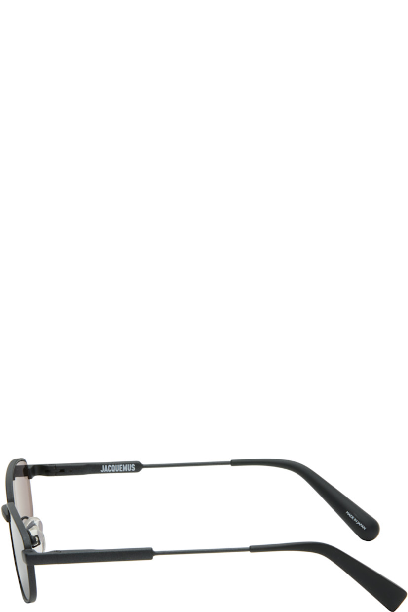 Rectangular stainless steel-frame sunglasses.

· Gray lenses
· 100% UVA/UVB protection, category 3 
· Adjustable rubber nose pads
· Logo etched at temples
· Navy acetate temple tips
· Includes pouch
· Size: 56.17 140

Supplier color: Black matt