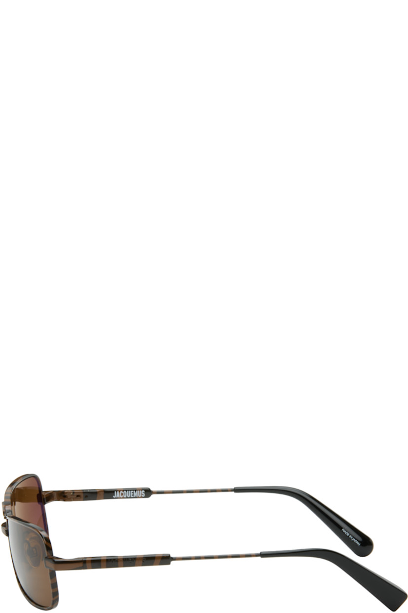 Rectangular metal-frame sunglasses.

· Graphic pattern printed throughout
· Brown lenses 
· Double bridge 
· Adjustable rubber nose pads
· Logo engraved at temples
· Acetate temple tips
· Includes pouch
· Size: 59.17 140

Supplier color: Dark brown zebra