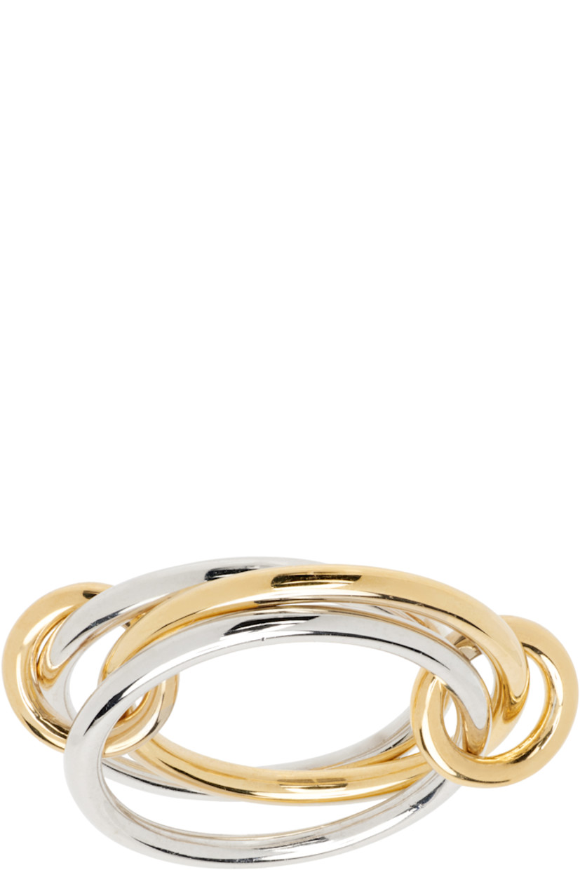 Handcrafted stacked rings in sterling silver and 18k yellow gold.

· Connecting hoops in 18k yellow gold
· Hallmarking at inner band

Supplier color: Silver/Gold