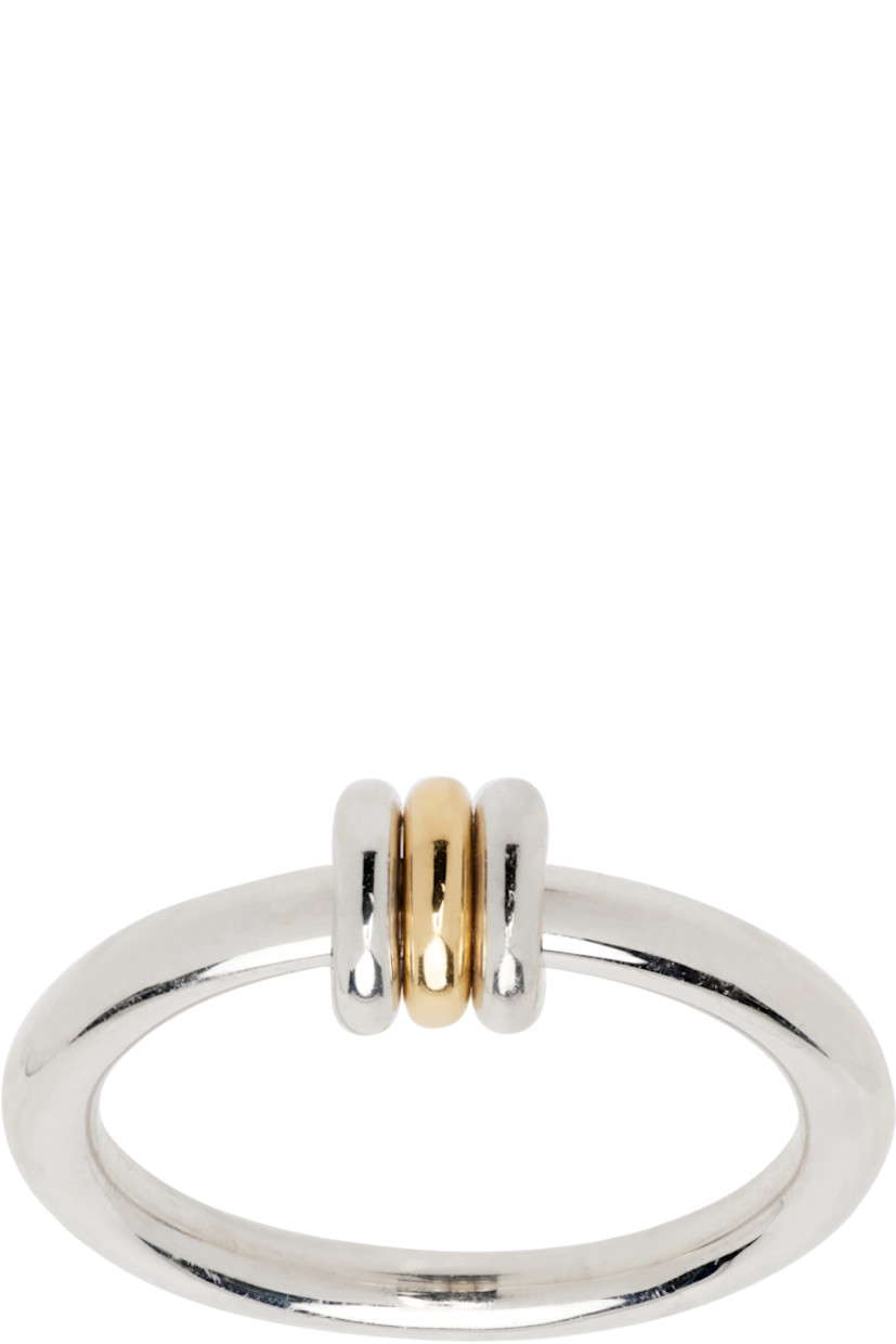 Handcrafted band ring in sterling silver.

· O-rings in sterling silver and 18k yellow gold
· Hallmarking at inner band

Supplier color: Silver/Gold