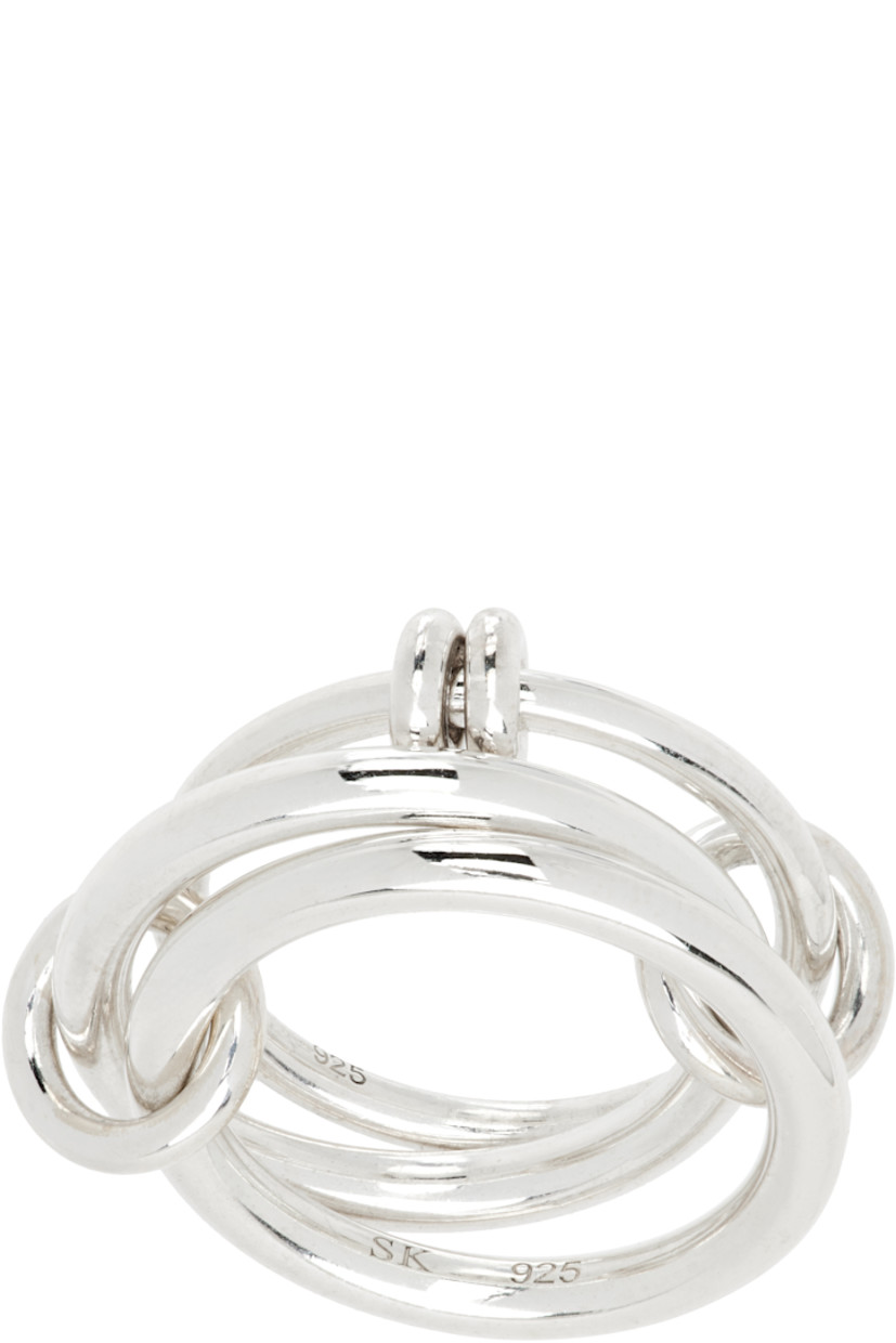 Handcrafted stacked rings in sterling silver. Connecting hoops at length.

Supplier color: Silver