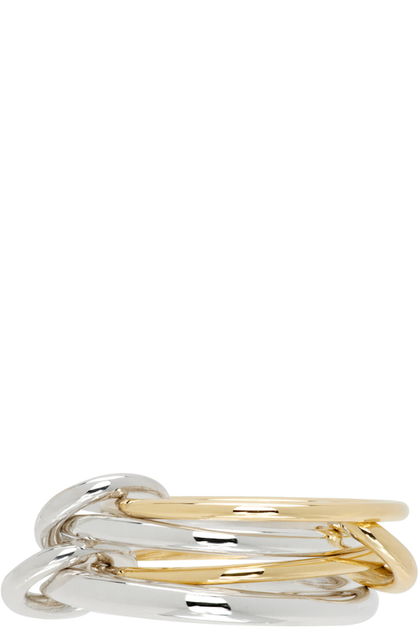 Handcrafted stacked rings in 18k gold and sterling silver. Connecting hoops at length.

Supplier color: Yellow gold/Silver