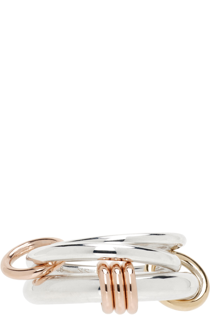 Handcrafted stacked rings in sterling silver.

· Connecting hoops in 18k yellow and rose gold
· Hallmarking at inner band

Supplier color: Silver/Gold