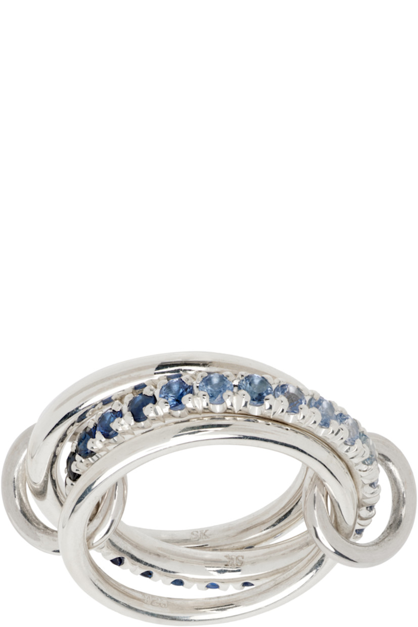 Handcrafted stacked rings in sterling silver.

· Connecting hoops at length
· Pavé-set gradient blue 1.40 cttw sapphires
· Hallmarking at inner band

Supplier color: Silver