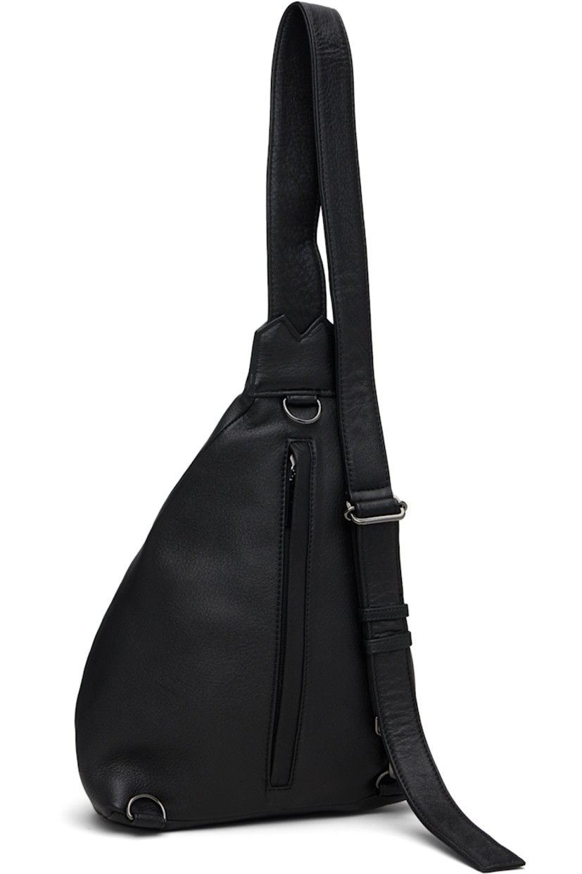 Grained leather shoulder bag.

· Convertible and adjustable crossbody strap
· Converts from left or right shoulder
· Pleat and embossed logo at face
· Zip closure at back face
· Zip pocket at interior
· Twill lining 
· H13" x W9" x D4.5"

Part of the discord YOHJI YAMAMOTO collection.

Supplier color: Black