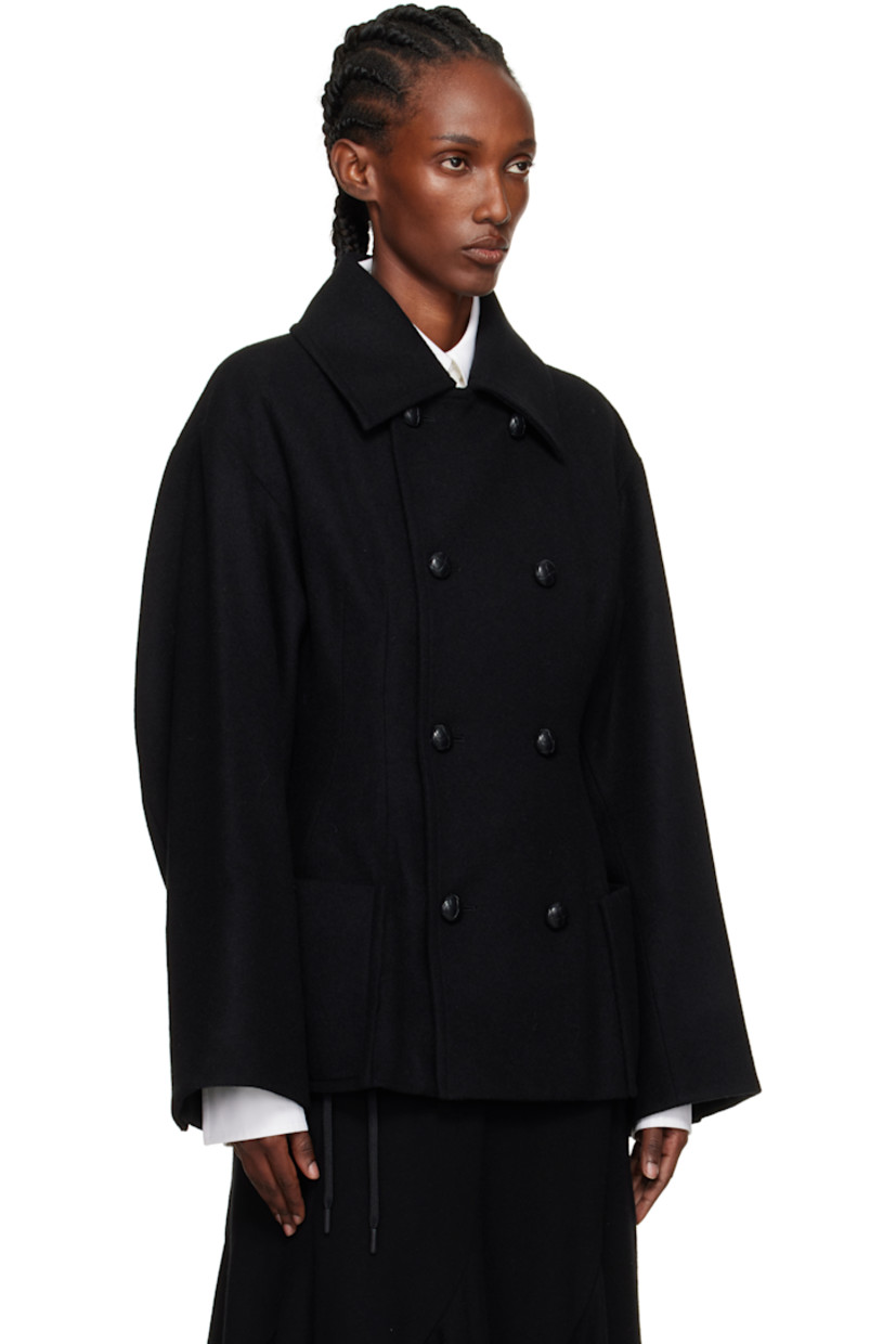 Wool-blend melton coat.

· Darts throughout
· Spread collar
· Double-breasted button closure
· Patch pockets at front
· Dropped shoulders
· Surgeon's cuffs
· Darts at back
· Full satin lining

Supplier color: Black