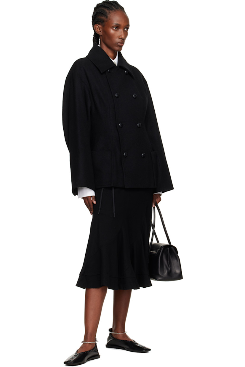 Wool-blend melton coat.

· Darts throughout
· Spread collar
· Double-breasted button closure
· Patch pockets at front
· Dropped shoulders
· Surgeon's cuffs
· Darts at back
· Full satin lining

Supplier color: Black