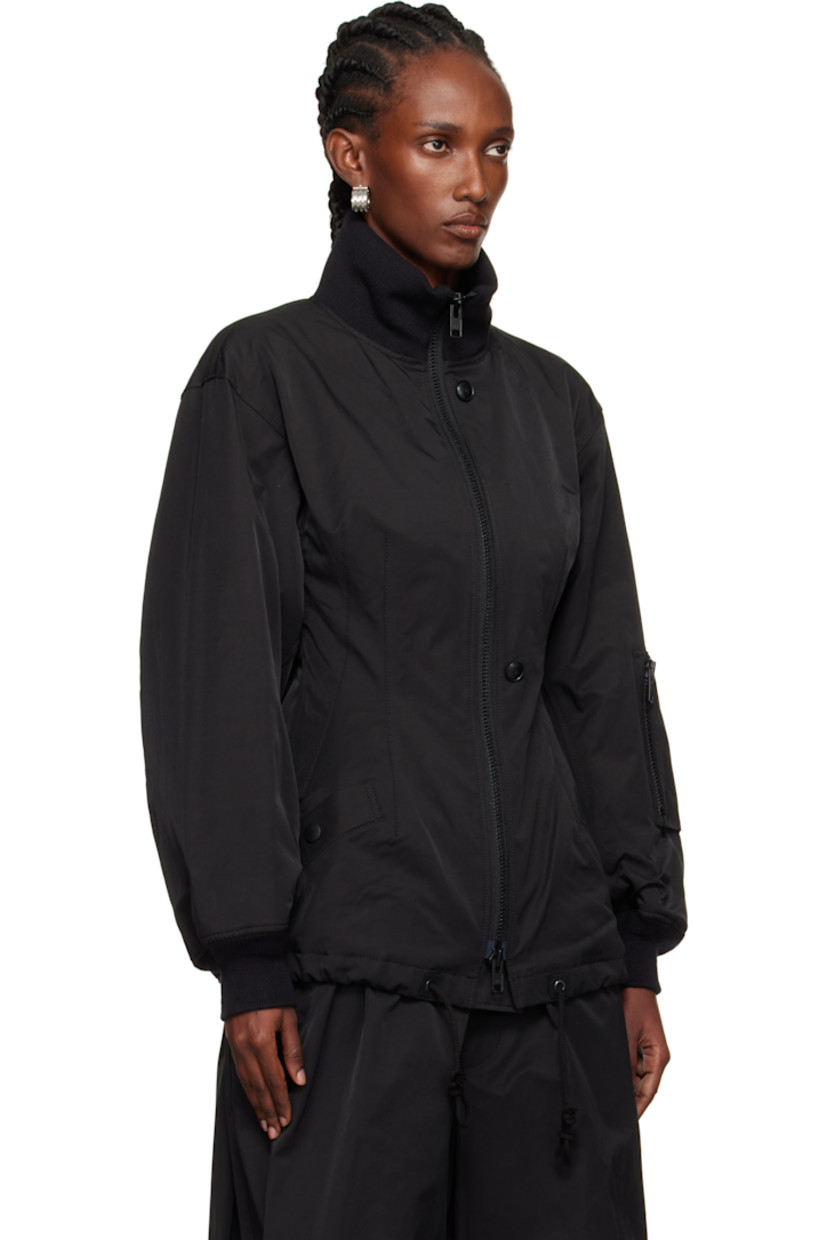 Insulated cotton- and nylon-blend twill bomber jacket.

· Rib-knit funnel neck and cuffs
· Two-way zip closure with button placket
· Welt pockets at front
· Darts at front and back
· Drawstring at hem
· Utility pocket at sleeve
· Full fleece and satin lining

Supplier color: Black