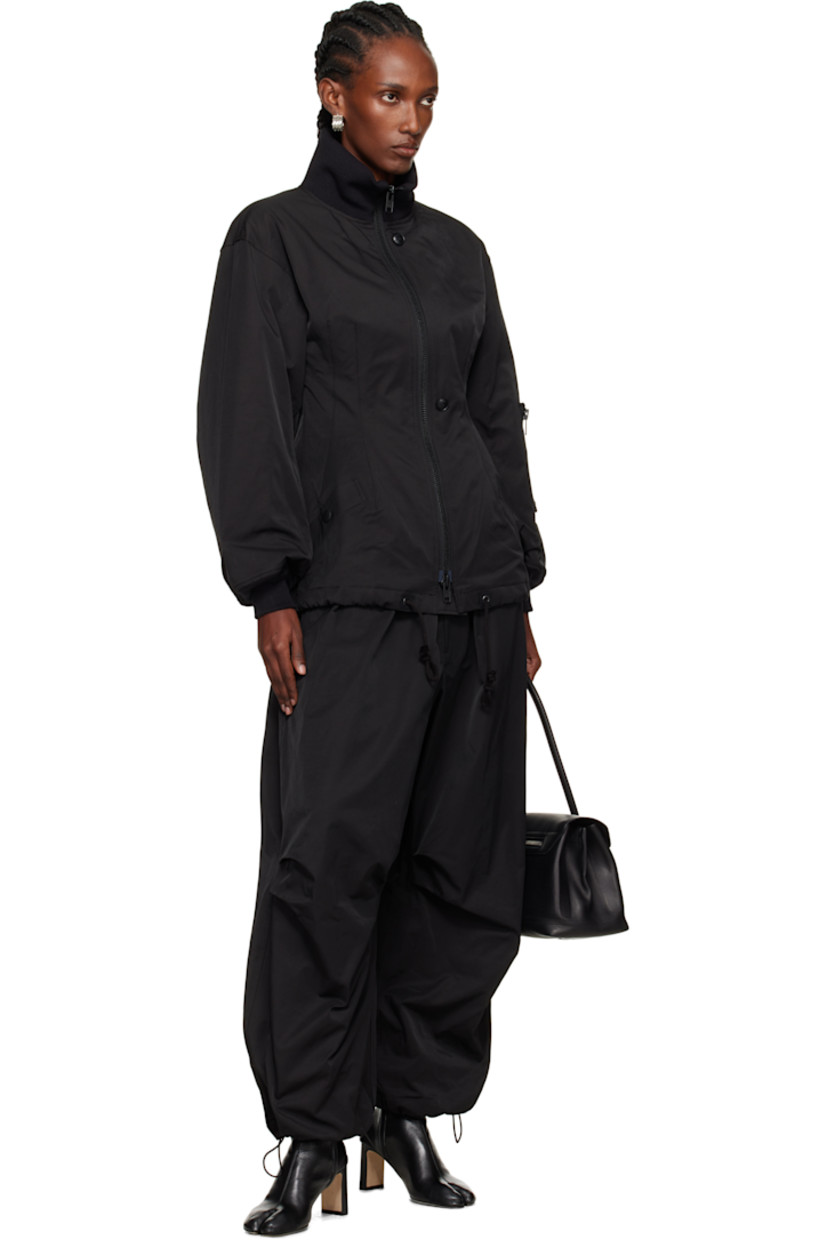 Insulated cotton- and nylon-blend twill bomber jacket.

· Rib-knit funnel neck and cuffs
· Two-way zip closure with button placket
· Welt pockets at front
· Darts at front and back
· Drawstring at hem
· Utility pocket at sleeve
· Full fleece and satin lining

Supplier color: Black