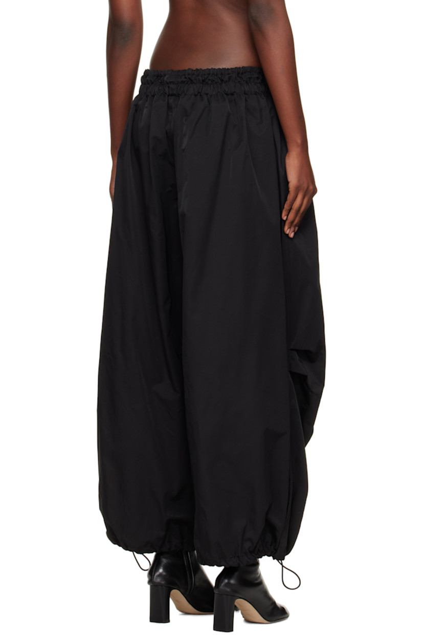 Nylon- and cotton-blend twill lounge pants.

· Loose-fit
· Bungee-style drawstring at elasticized waistband 
· Two-pocket styling
· Mock fly
· Bungee-style drawstring at cuffs

Supplier color: Black