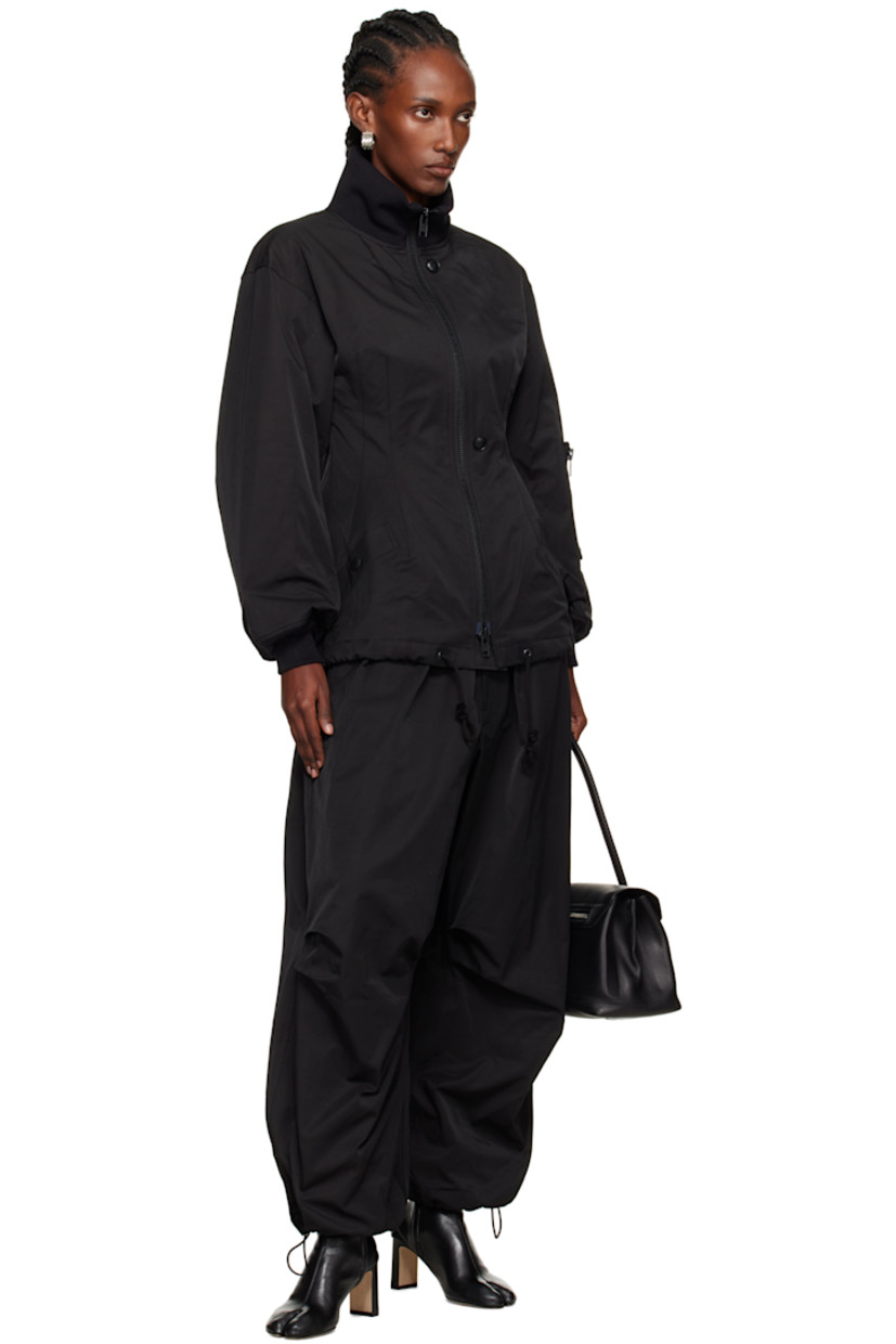 Nylon- and cotton-blend twill lounge pants.

· Loose-fit
· Bungee-style drawstring at elasticized waistband 
· Two-pocket styling
· Mock fly
· Bungee-style drawstring at cuffs

Supplier color: Black