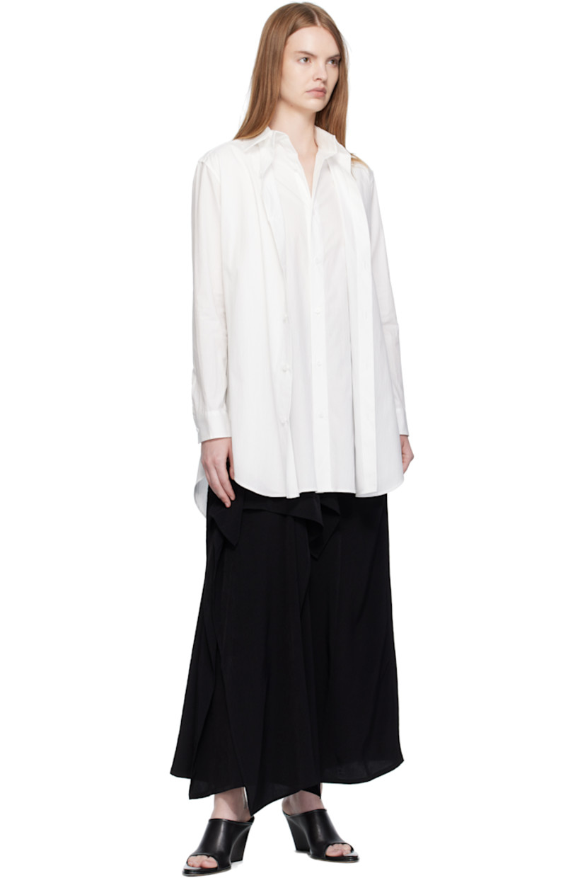 Crêpe de chine midi skirt. 

· Wrap construction 
· Draping throughout 
· High-rise 

Part of 'Yohji Yamamoto collections'.

Supplier color: Black