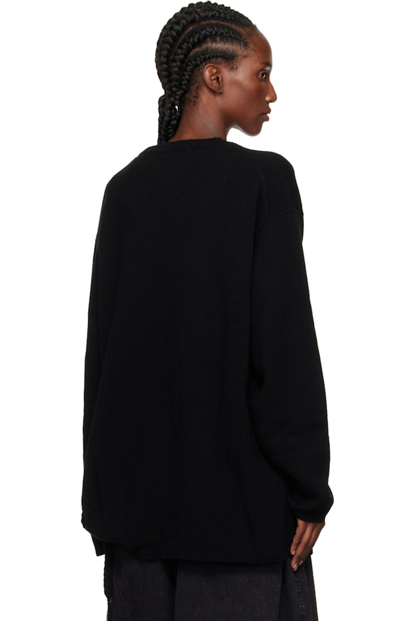 Knit wool sweater.

· Rib-knit crewneck, hem, and cuffs
· Braided extended trim at hem side seam
· Dropped shoulders

Part of the Yohji Yamamoto POUR HOMME collection.

Supplier color: Black