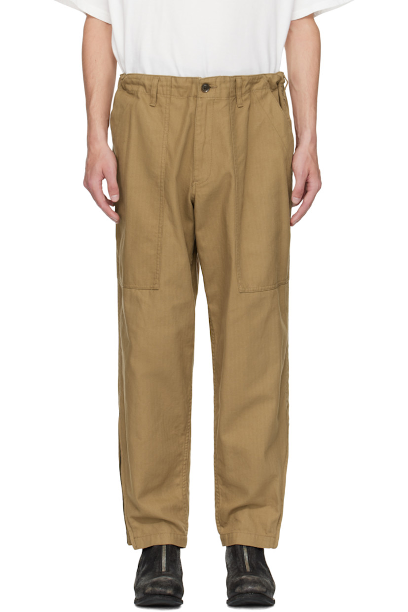 Cotton herringbone trousers.

· Concealed drawstring at waistband
· Belt loops
· Four-pocket styling
· Zip fly
· Zip expansion panel at cuffs
· Logo flag at back pocket

Part of the Yohji Yamamoto POUR HOMME collection.

Supplier color: Beige
