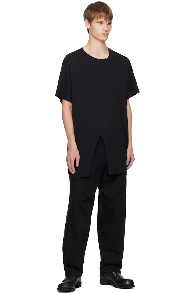 Cotton drill trousers.

· Concealed drawstring at waistband
· Belt loops
· Four-pocket styling
· Zip fly
· Zip expansion panel at cuffs
· Logo flag at back pocket

Part of the Yohji Yamamoto POUR HOMME collection.

Supplier color: Black
