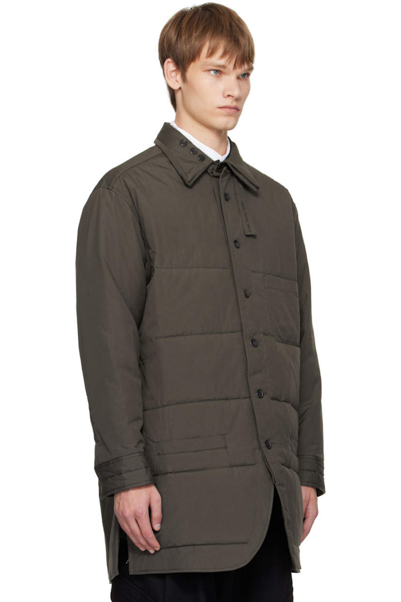 Padded and quilted cotton poplin shirt.

· Adjustable button tab at padded spread collar
· Button closure
· Patch pocket at chest
· Welt pockets at waist
· Vented side seams
· Adjustable buttoned barrel cuffs
· Full sateen lining

Part of the Yohji Yamamoto POUR HOMME collection.

Supplier color: Grey
