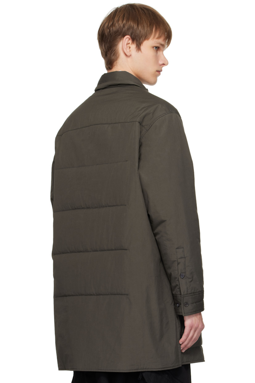 Padded and quilted cotton poplin shirt.

· Adjustable button tab at padded spread collar
· Button closure
· Patch pocket at chest
· Welt pockets at waist
· Vented side seams
· Adjustable buttoned barrel cuffs
· Full sateen lining

Part of the Yohji Yamamoto POUR HOMME collection.

Supplier color: Grey