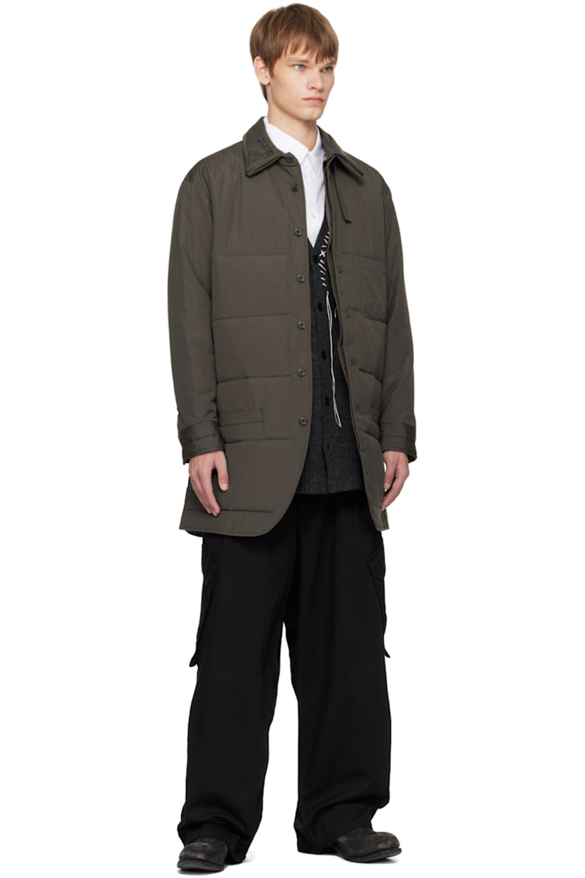 Padded and quilted cotton poplin shirt.

· Adjustable button tab at padded spread collar
· Button closure
· Patch pocket at chest
· Welt pockets at waist
· Vented side seams
· Adjustable buttoned barrel cuffs
· Full sateen lining

Part of the Yohji Yamamoto POUR HOMME collection.

Supplier color: Grey