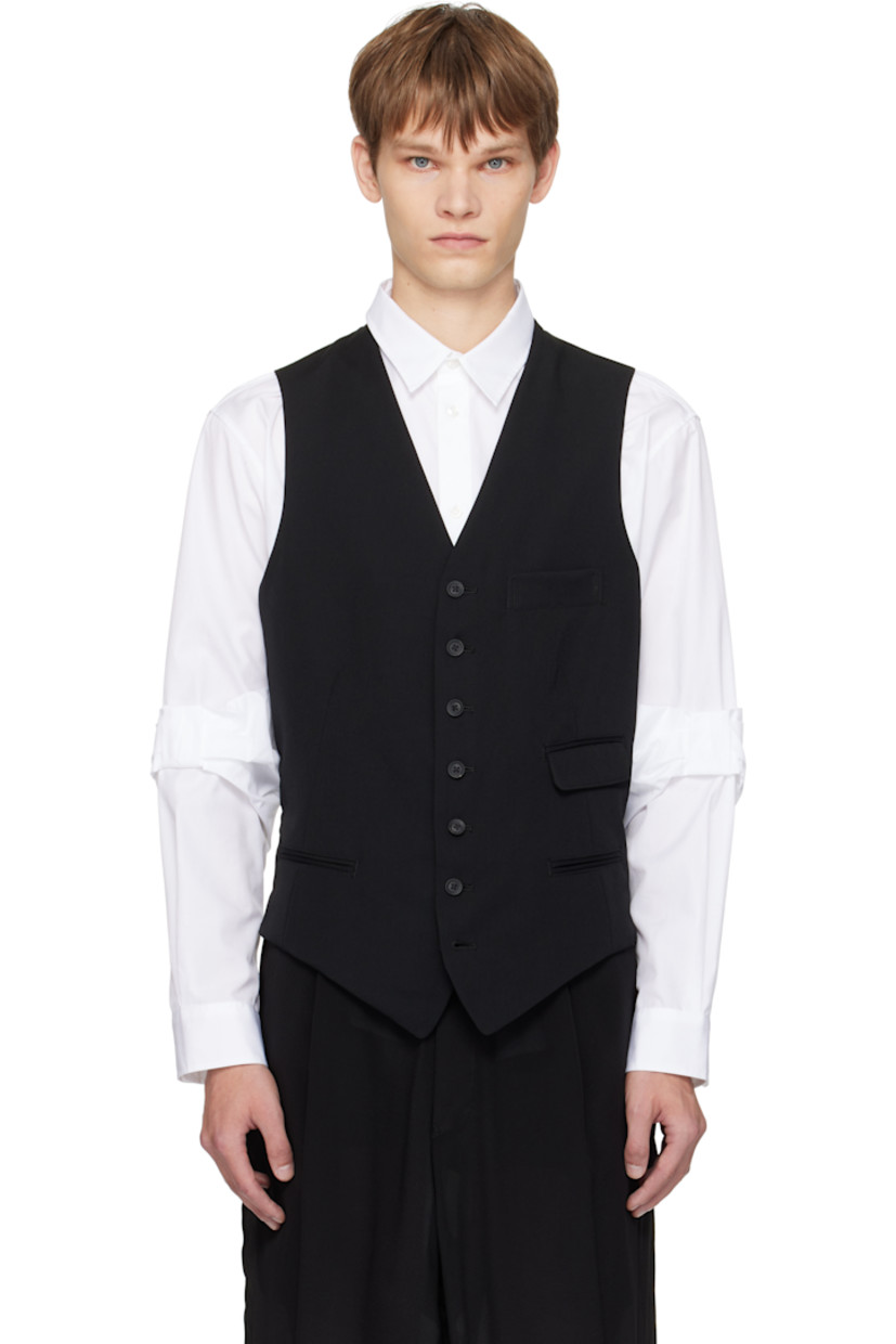 Wool gabardine waistcoat.

· V-neck
· Button closure
· Welt pockets and flap pocket at front
· Cinch strap at back waist
· Logo patch at interior
· Full cupro sateen lining

Part of the Yohji Yamamoto POUR HOMME collection.

Supplier color: Black