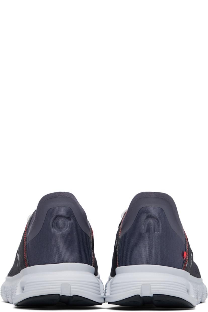 Low-top mesh sneakers in black and navy. 

· Bungee-style lace-up closure
· Logo printed at tongue
· Reflective logo bonded at sides 
· Logo embossed at heel tab
· CloudTec® foam rubber midsole
· Treaded Speedboard® rubber sole

Part of the On x MITA collaboration.

Supplier color: Magnet/Sand