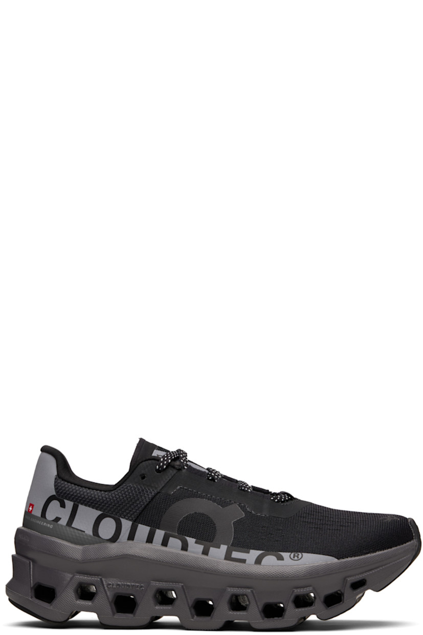 Low-top mesh sneakers.

· Reflective logos and text bonded throughout
· Logo embossed at toe
· Lace-up closure
· Padded collar
· CloudTec® Helion™ foam rubber midsole
· Treaded Speedboard™ rubber sole

Supplier color: Black