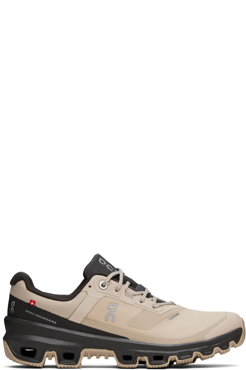 Waterproof low-top mesh sneakers in beige.

· Bonded trim and reflective logos throughout
· Lace-up closure
· Padded tongue and collar
· Reflective trim at sides
· Mesh lining
· Cushioned CloudTec® Helion™ foam rubber midsole
· Treaded Missiongrip™ sole

Supplier color: Sand/Pebble