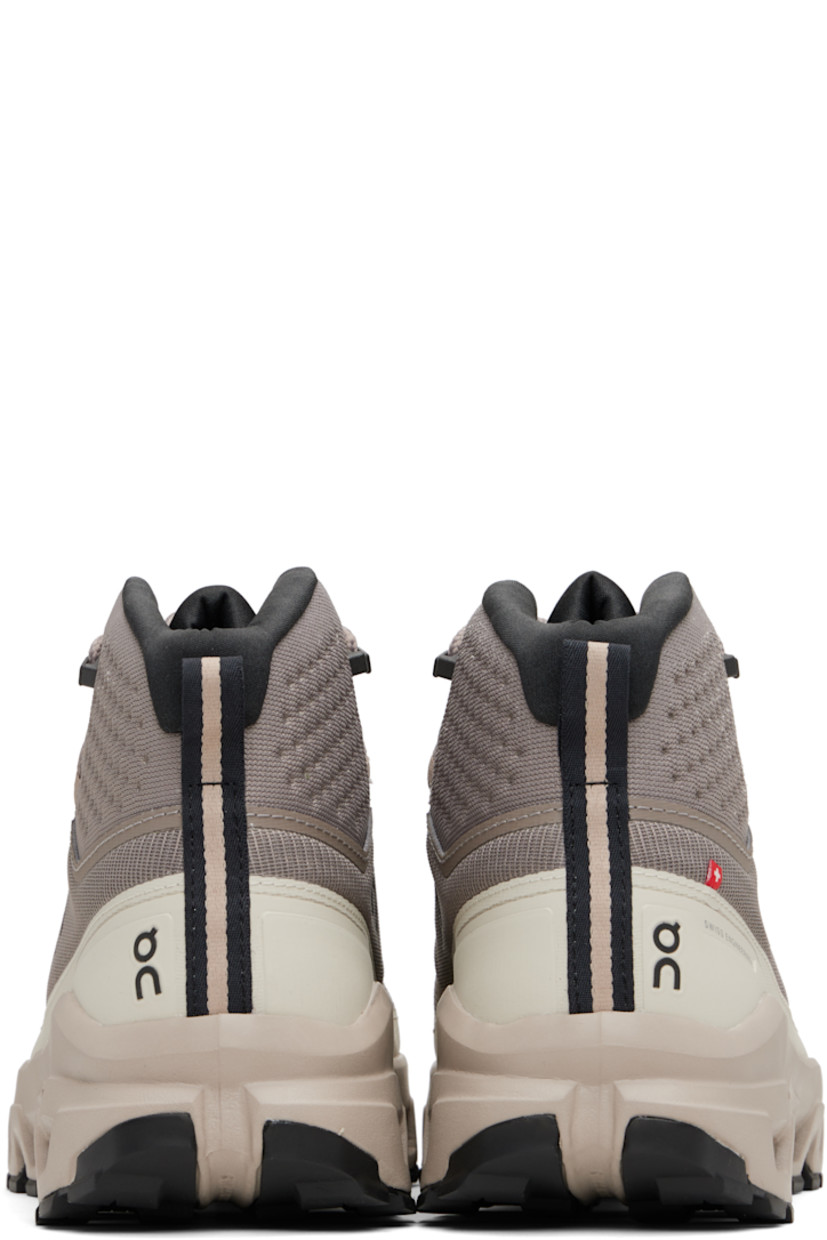 Mid-top recycled mesh sneakers.

· Waterproof
· Logo embossed at toe
· Lace-up closure
· Reflective logo printed at padded tongue
· Padded collar
· Logo bonded at sides and heel counter
· Pull-loop at heel collar
· Jersey lining
· Cushioned CloudTec® Helion™ superfoam rubber midsole
· Treaded Missiongrip™ and Speedboard® rubber sole

Supplier color: Cinder/Desert