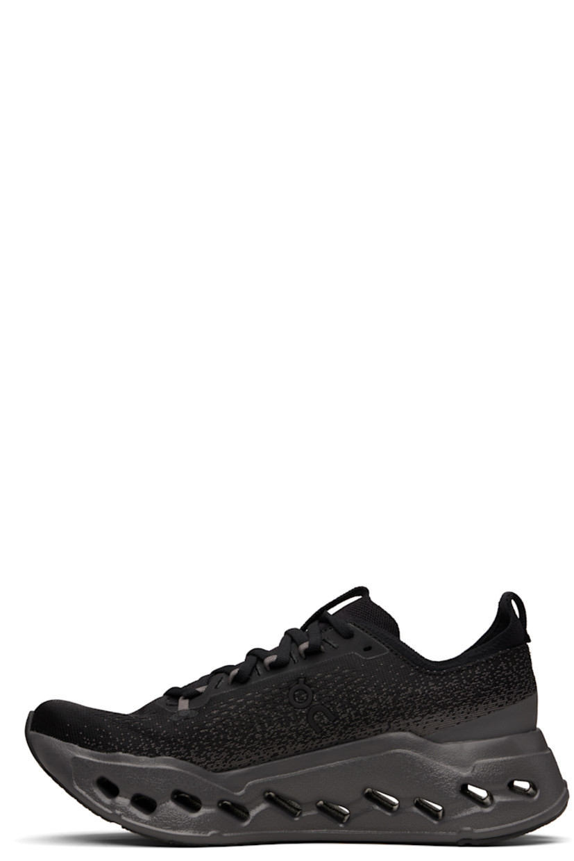 Low-top knit sneakers.

· Jacquard pattern throughout
· Lace up closure
· Logo bonded at sides
· Logo bonded at tongue, collar, and sides 
· Pull loop at tongue and heel tab
· Padded collar
· Helion™ foam rubber midsole
· Treaded CloudTec Phase® rubber sole 

Supplier color: Black/Eclipse