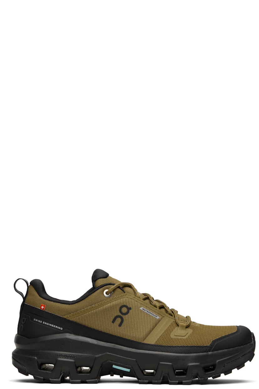 Low-top recycled mesh sneakers.

· Waterproof
· Bonded trim throughout
· Polymer toe cap and mudguard
· Lace-up closure
· Padded tongue and collar
· Logo bonded at tongue, sides, and heel
· Pull-loop at heel tab
· Helion™ superfoam rubber midsole
· Treaded Missiongrip™ and Speedboard® rubber sole

Supplier color: Hunter/Black