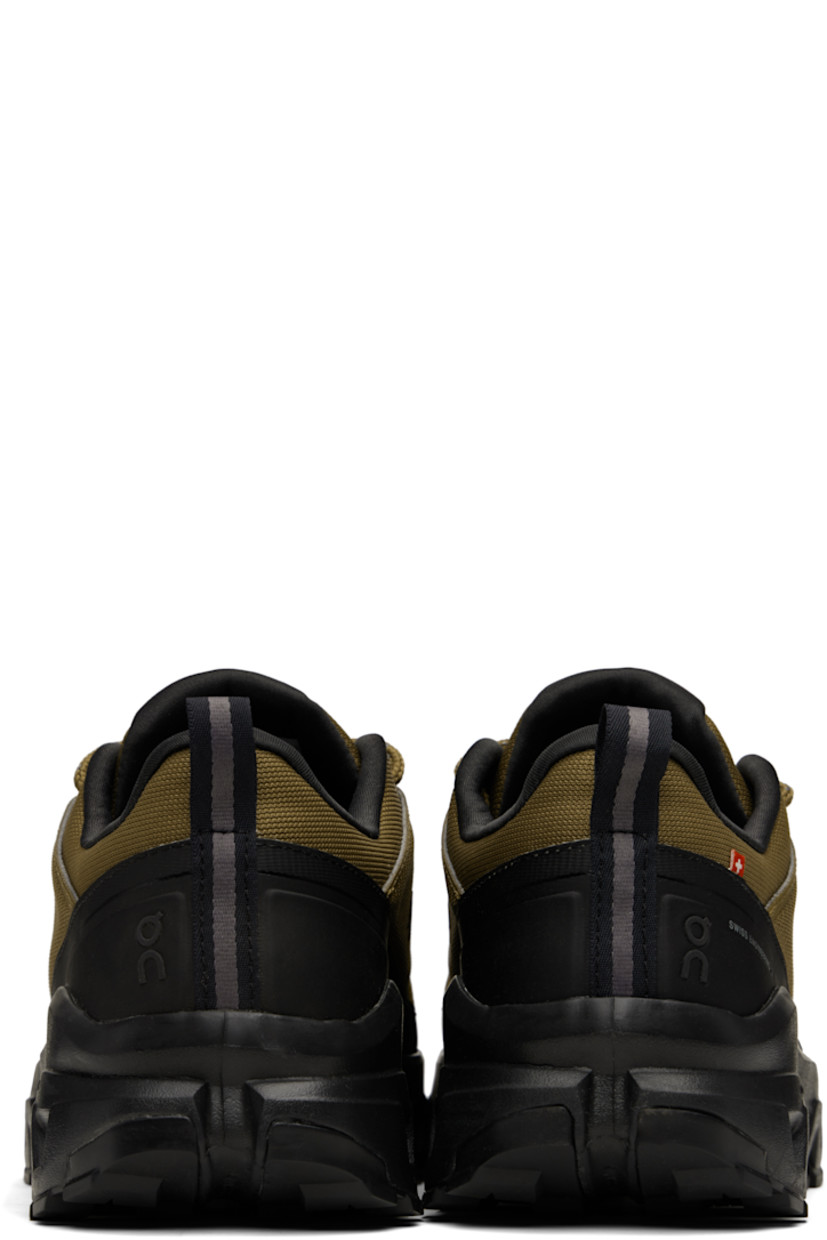 Low-top recycled mesh sneakers.

· Waterproof
· Bonded trim throughout
· Polymer toe cap and mudguard
· Lace-up closure
· Padded tongue and collar
· Logo bonded at tongue, sides, and heel
· Pull-loop at heel tab
· Helion™ superfoam rubber midsole
· Treaded Missiongrip™ and Speedboard® rubber sole

Supplier color: Hunter/Black