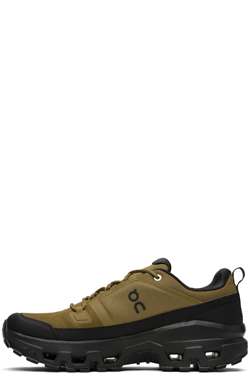 Low-top recycled mesh sneakers.

· Waterproof
· Bonded trim throughout
· Polymer toe cap and mudguard
· Lace-up closure
· Padded tongue and collar
· Logo bonded at tongue, sides, and heel
· Pull-loop at heel tab
· Helion™ superfoam rubber midsole
· Treaded Missiongrip™ and Speedboard® rubber sole

Supplier color: Hunter/Black