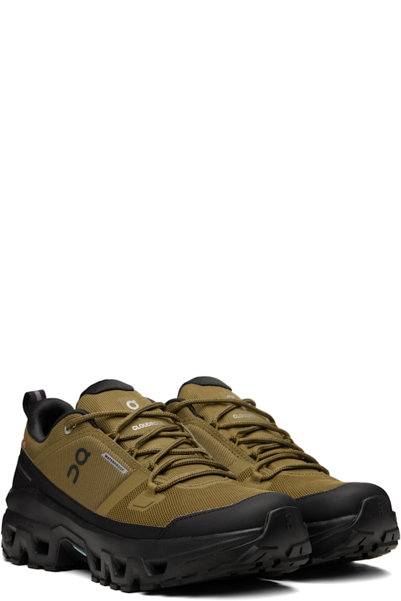 Low-top recycled mesh sneakers.

· Waterproof
· Bonded trim throughout
· Polymer toe cap and mudguard
· Lace-up closure
· Padded tongue and collar
· Logo bonded at tongue, sides, and heel
· Pull-loop at heel tab
· Helion™ superfoam rubber midsole
· Treaded Missiongrip™ and Speedboard® rubber sole

Supplier color: Hunter/Black