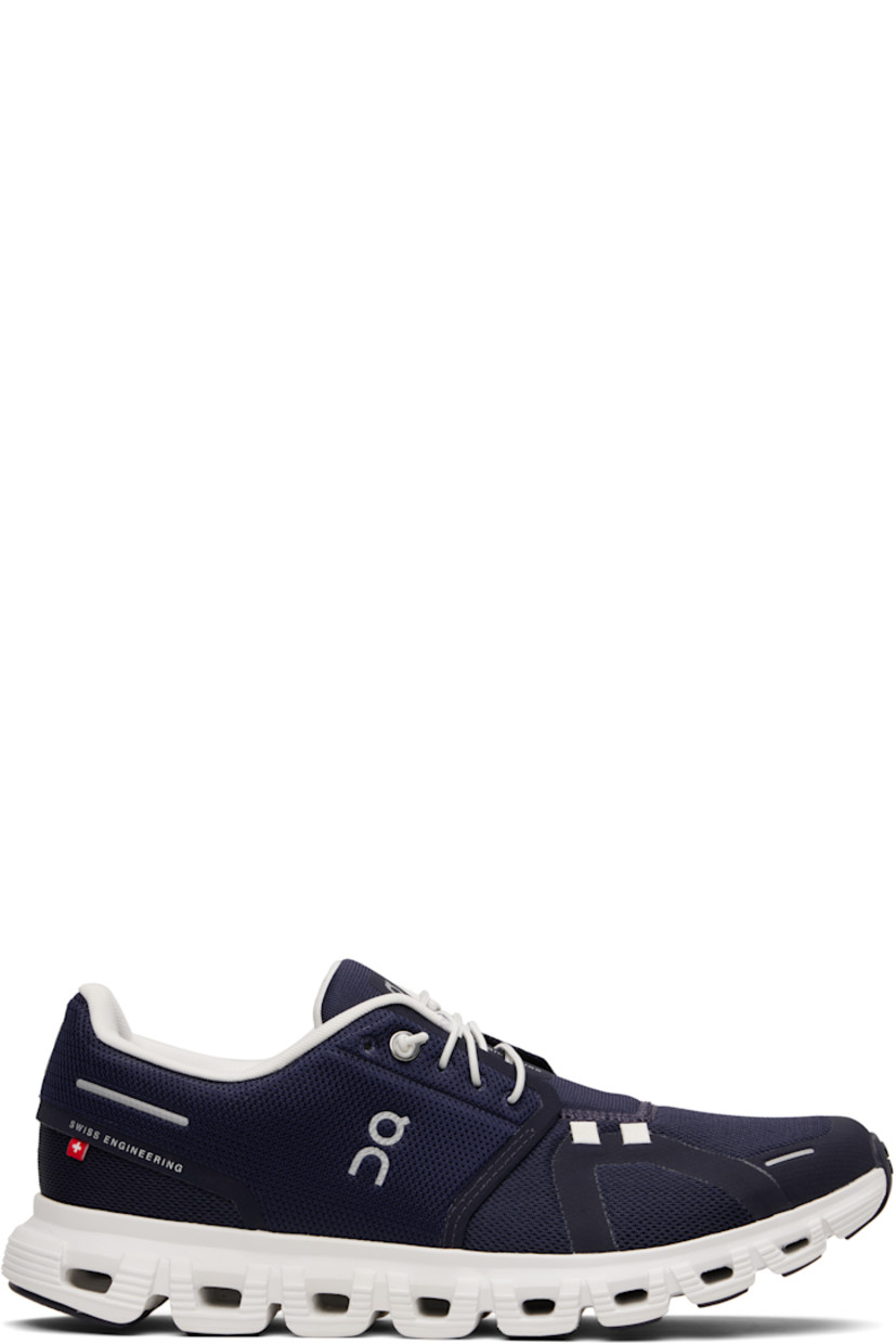 Low-top recycled mesh sneakers.

· Reflective trim and logos bonded throughout
· Elasticized lace-up closure
· Padded tongue and collar
· Zero-Gravity CloudTec® foam rubber midsole
· Treaded Speedboard® rubber sole

Supplier color: Midnight/White