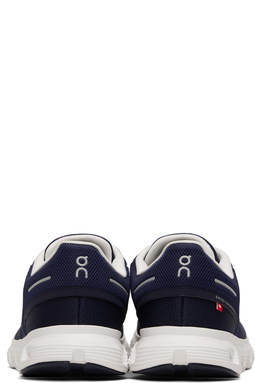Low-top recycled mesh sneakers.

· Reflective trim and logos bonded throughout
· Elasticized lace-up closure
· Padded tongue and collar
· Zero-Gravity CloudTec® foam rubber midsole
· Treaded Speedboard® rubber sole

Supplier color: Midnight/White