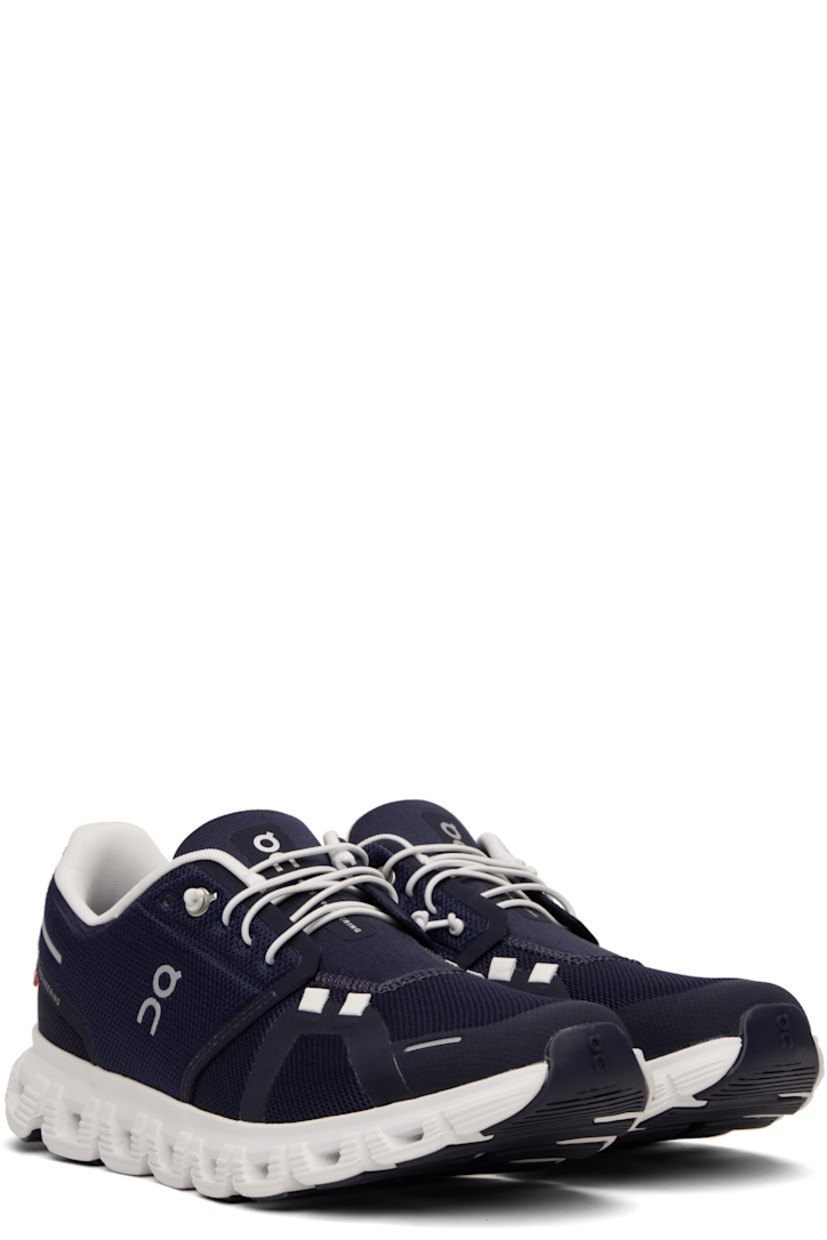 Low-top recycled mesh sneakers.

· Reflective trim and logos bonded throughout
· Elasticized lace-up closure
· Padded tongue and collar
· Zero-Gravity CloudTec® foam rubber midsole
· Treaded Speedboard® rubber sole

Supplier color: Midnight/White