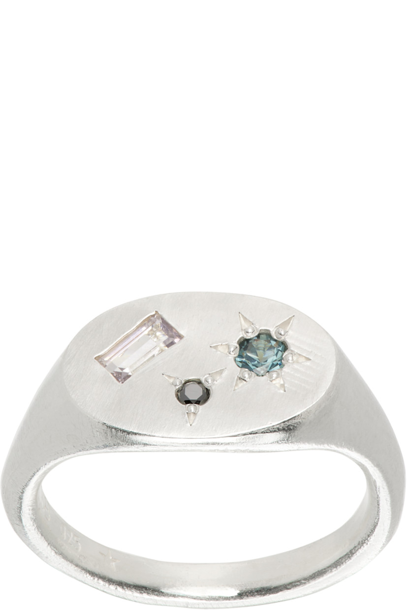 Signet ring in sterling silver.

· Bezel-set spinel stones and 0.1 ct black diamond at face
· Hallmarking at inner band

Supplier color: Sterling silver (925)